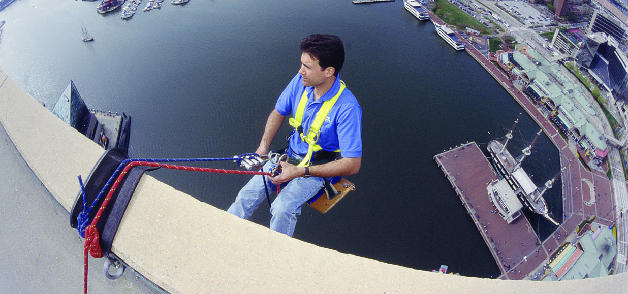 Gus Strats suspends from newly-installed anchorages on the World Trade Center in Baltimore, MD, in the late 1990s.